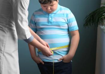 Doctor measuring overweight boy in clinic - Image credit: Africa Studio | stock.adobe.com