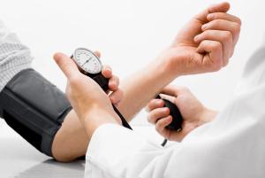 Women with blood pressure cuff -- Image credit: Andrei Tsalko | stock.adobe.com