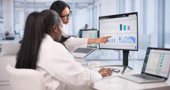 Health care workers on a computer -- Image credit: Andrey Popov | stock.adobe.com