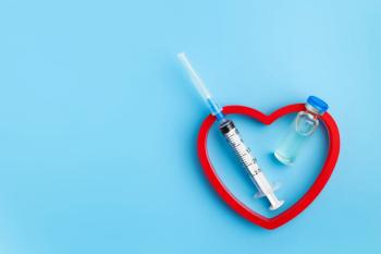 Heart Injection And Vaccine Vial. Covid 19 Cure. Medical Ampoule Dose And Needle On Blue Background, Top View With Copy Space - Image credit: Polina Zait | stock.adobe.com
