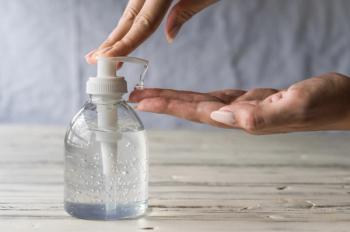Young woman using hand sanitizer gel with liquid alcohol disinfectant for prevention of coronavirus and other pandemic and epidemic diseases | Image Credit: Aleksandr Vorobev - stock.adobe.com