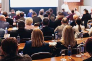 Health care professionals attending a medical conference presentation -- Image credit: tsuguliev | stock.adobe.com