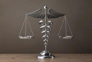 Silver Medical Caduceus Symbol as Scales. 3d Rendering - Image credit: doomu | stock.adobe.com