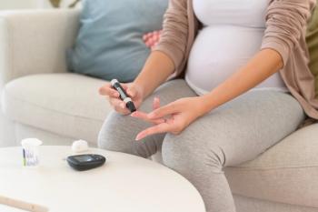Pregnant woman checking blood sugar level by using Digital Glucose meter, health care, medicine, diabetes, glycemia concept - Image credit: tonefotografia | stock.adobe.com