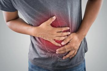 The photo of large intestine is on the man's body against gray background, People With Stomach ache problem concept, Male anatomy | Image credit: eddows | stock.adobe.com