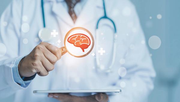 Doctor examines digital brain scan on tablet displaying neural network and medical technology | Image Credit: Your Design Master | stock.adobe.com