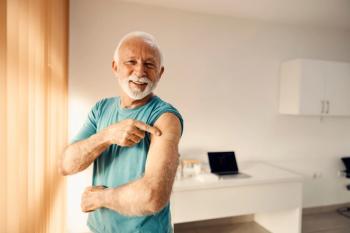 A happy senior man in doctor's office pointing at his vaccinated shoulder. Immunization and vaccination. | Image Credit: Dusan Petkovic | stock.adobe.com