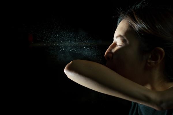 Woman coughing or sneezing in her elbow. Concept of stop spread of the virus. Spray infection - Image credit: marchsirawit | stock.adobe.com
