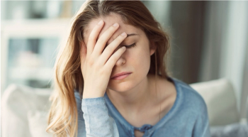 Woman with headache | Image credit: Sebra - stock.adobe.com