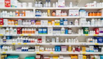 Pharmacy shelves filled with flu medicine and vitamins, healthcare concept, Flu Season Care - Image credit: Nii_Anna | stock.adobe.com