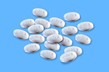 Image Credit: Ole | stock.adobe.com | Stack of pills from Novo Nordisk lies on a blue background. Copenhagen, Denmark - December 23, 2025.