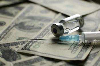 Vial with syringe vaccine and many dollars - Image credit: Qwenergy | stock.adobe.com