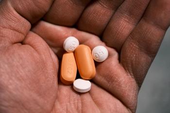 Man holding antiretroviral drugs