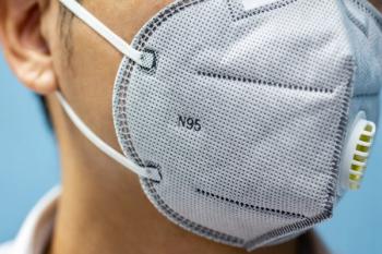 A man is wearing n95 mask for protect covid 19 and air pollution pm2.5. Credit: shertut - stock.adobe.com