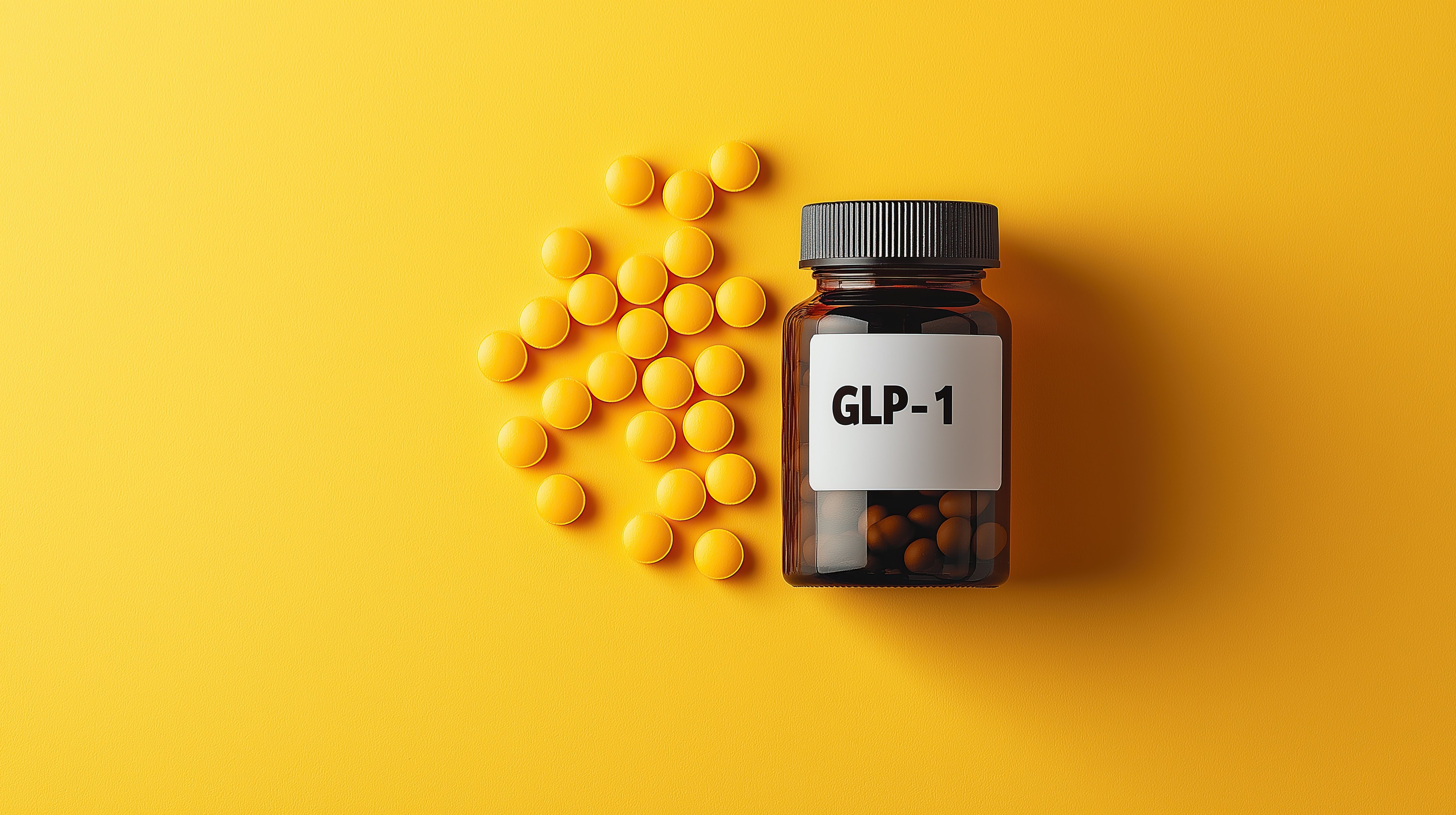 GLP-1 medication bottle with yellow tablets for managing type 2 diabetes and obesity, symbolizing pharmaceutical treatment for blood sugar and weight control - Image credit: Ryan | stock.adobe.com