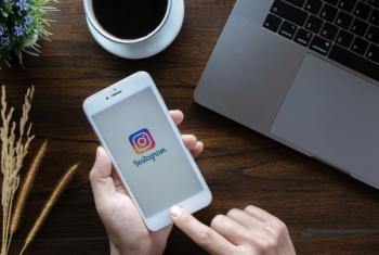 Woman using Instagram on her phone -- Image credit: Jirapong | stock.adobe.com