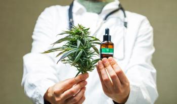 Health care professional with cannabis, CBD oil -- Image credit: Elroi | stock.adobe.com