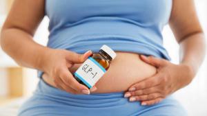 GLP-1 vial held by overweight person on stomach, weight loss, healthcare concept, medical treatment, diabetes management, metabolic health research, pharmaceutical marketing, clinical study imagery | Image Credit: Dina Photo Stories | stock.adobe.com