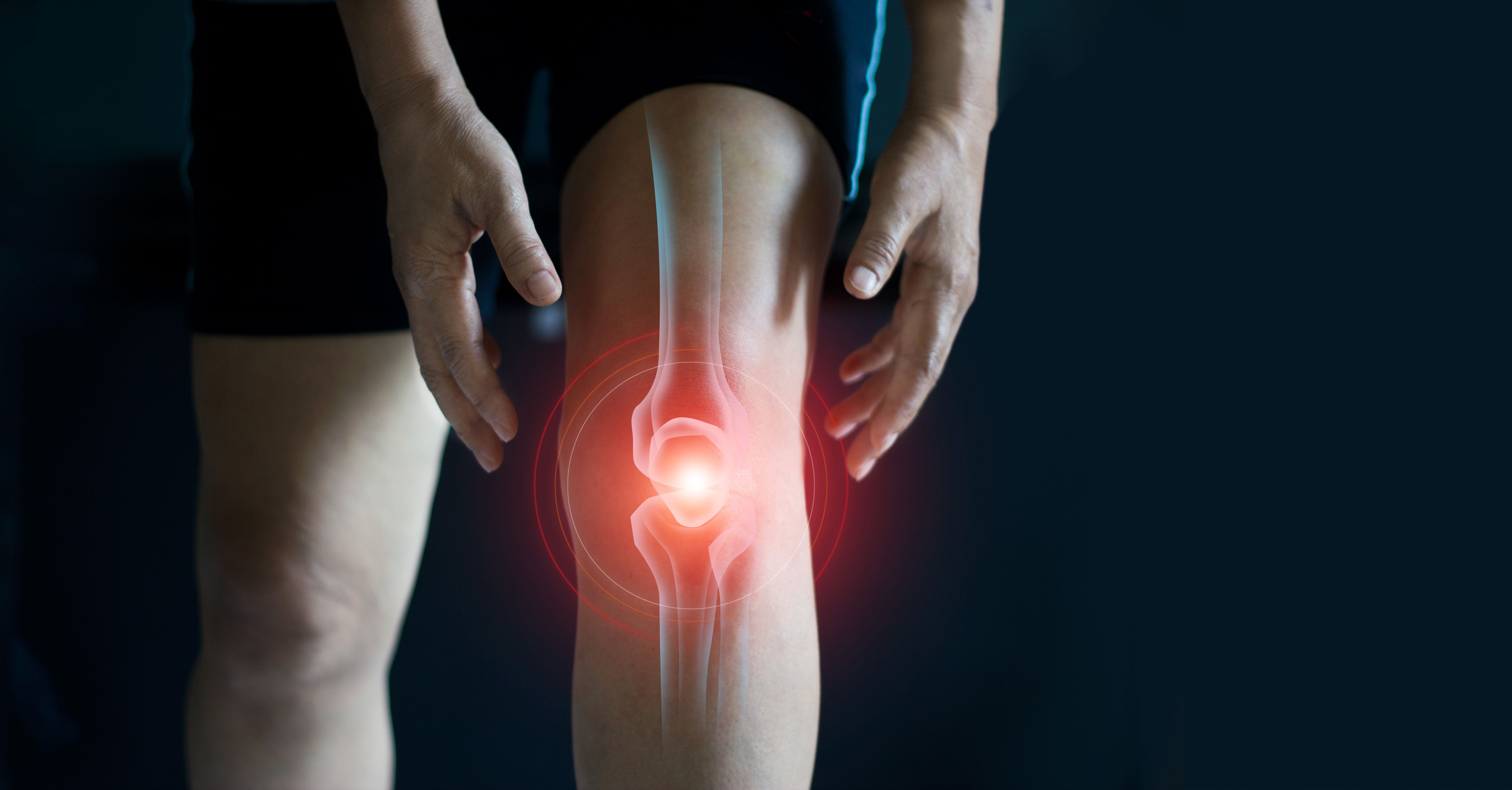 Elderly woman suffering from pain in knee. Tendon problems and Joint inflammation on dark background - Image credit: ipopba | stock.adobe.com