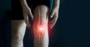 Elderly woman suffering from pain in knee. Tendon problems and Joint inflammation on dark background - Image credit: ipopba | stock.adobe.com