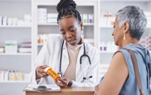 Black woman, doctor and prescription medication for patient or over the counter pills at pharmacy. African medical pharmacist consulting senior client for dosage, symptoms or side effects at clinic | Image Credit: C. Davids/peopleimages.com | stock.adobe.com