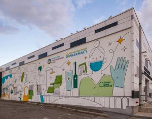 Niagara Falls Community Health Centre building in Niagara Falls, Ontario, Canada on August 1, 2022 back of building with graphic art on the exterior.