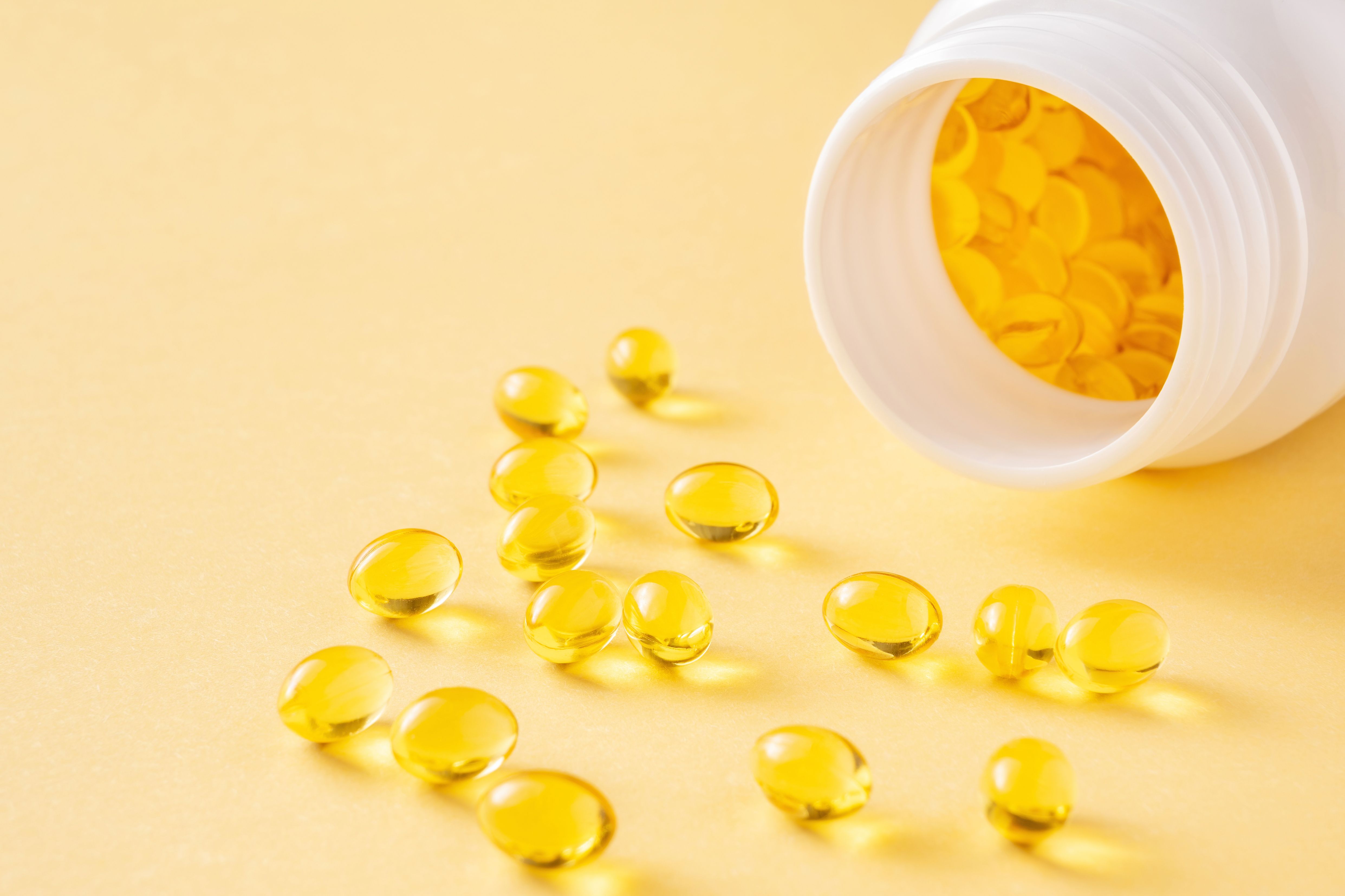 Bottle of vitamin E softgels -- Image credit: Volha |stock.adobe.com