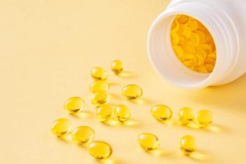Bottle of vitamin E softgels -- Image credit: Volha |stock.adobe.com