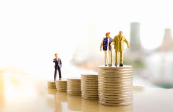 Concept of retirement planning. Miniature people: Old couple figure standing on top of coin stack - Image credit: Khongtham | stock.adobe.com