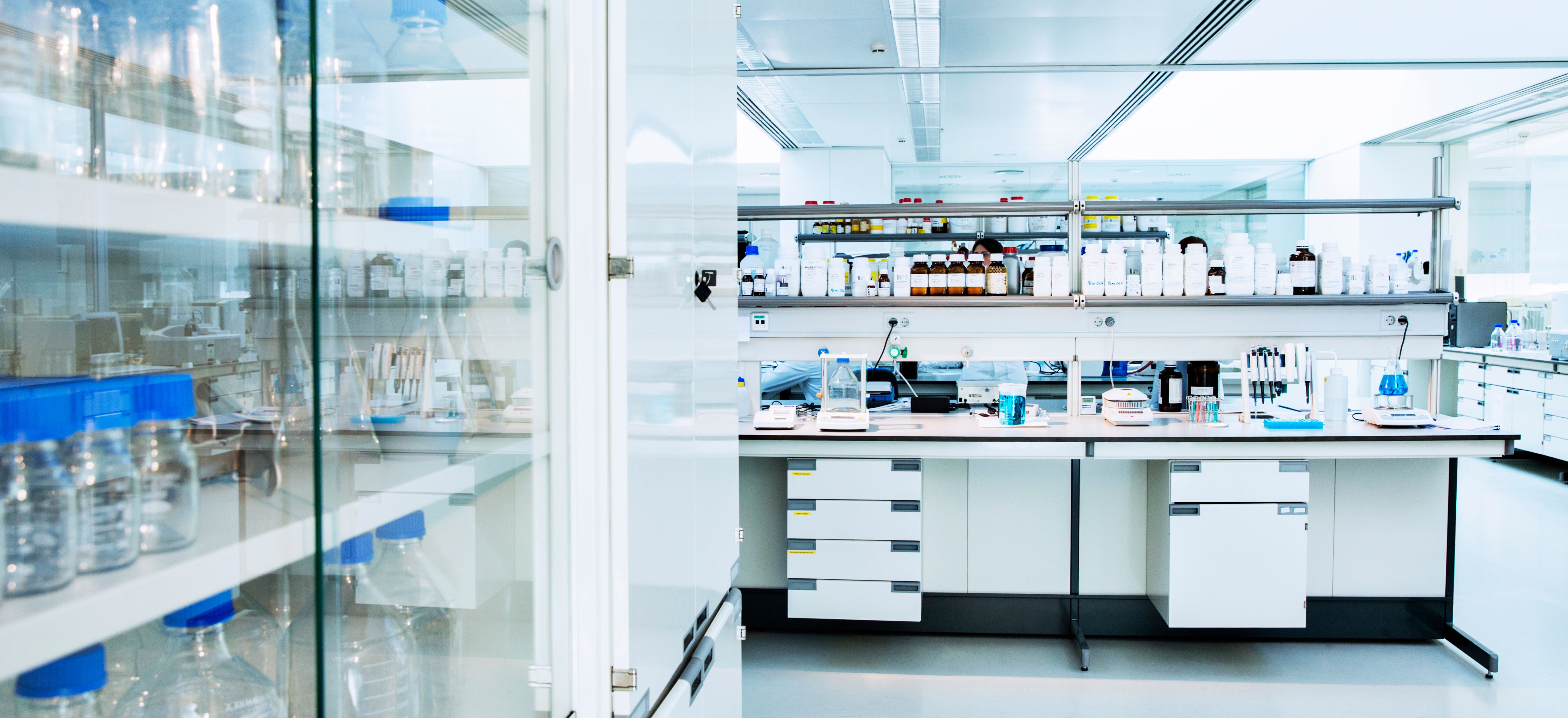 Cabinet, shelves and equipment in laboratory - Image credit: Chris Ryan/KOTO | stock.adobe.com