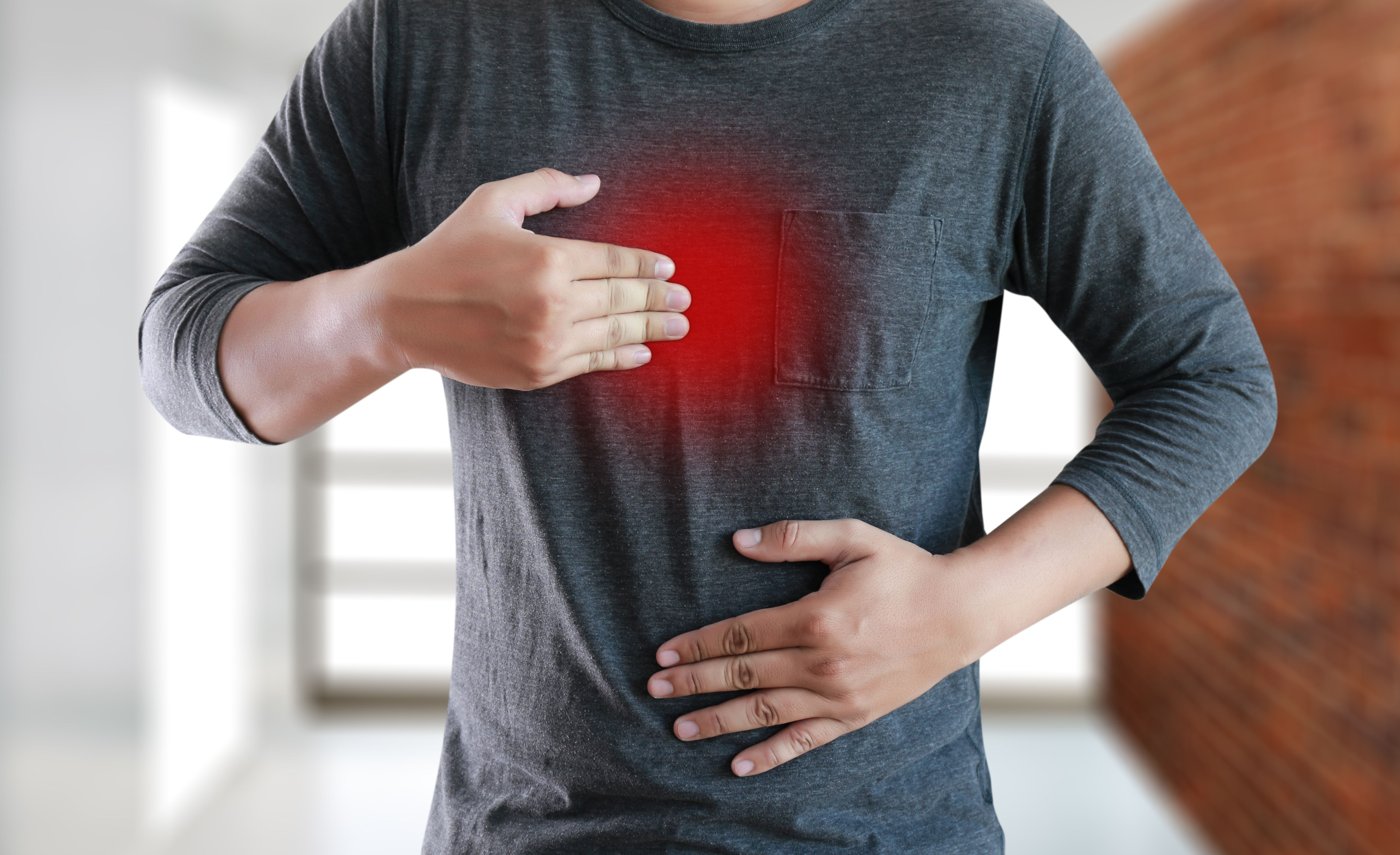 MAN with symptomatic acid reflux , suffering from acid reflux - Image credit: Onephoto | stock.adobe.com