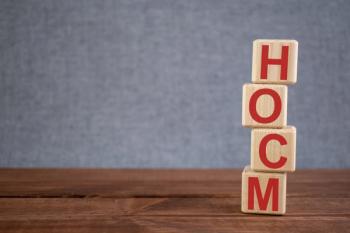 Abbreviation HOCM (hypertrophic obstructive cardiomyopathy) text acronym on wooden cubes on dark wooden backround. Medicine concept. | Image Credit: Anna | stock.adobe.com