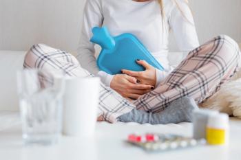 Woman with menstrual pain -- Image credit: Kaspars Grinvalds | stock.adobe.com