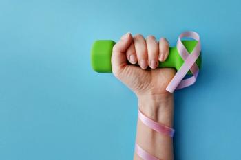 Dumbbell with pink breast cancer ribbon | Image Credit: © fidaolga - stock.adobe.com