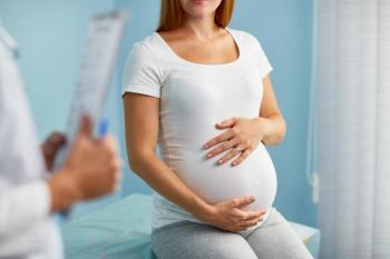 Pregnant woman with doctor -- Image credit: pressmaster | stock.adobe.com