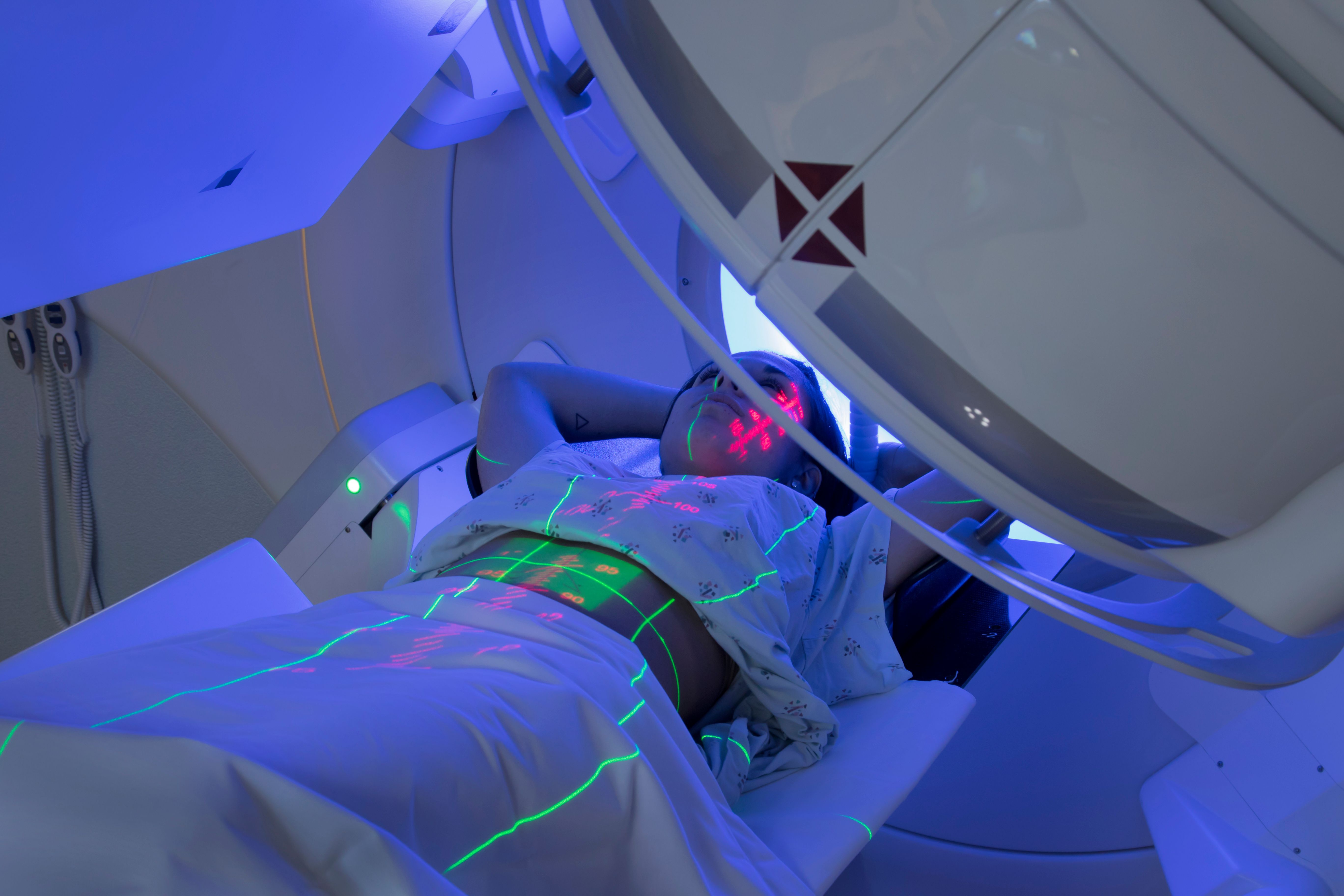 Woman receiving radiotherapy | Image Credit: © Mark Kostich - stock.adobe.com