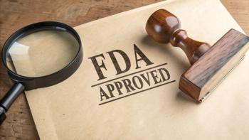 'FDA APPROVED' stamped on textured paper, beside a magnifying glass and wooden rubber stamp, symbolizing certification, quality assurance, and regulatory approval | Image Credit: StocksJust4You | adobe.stock.com