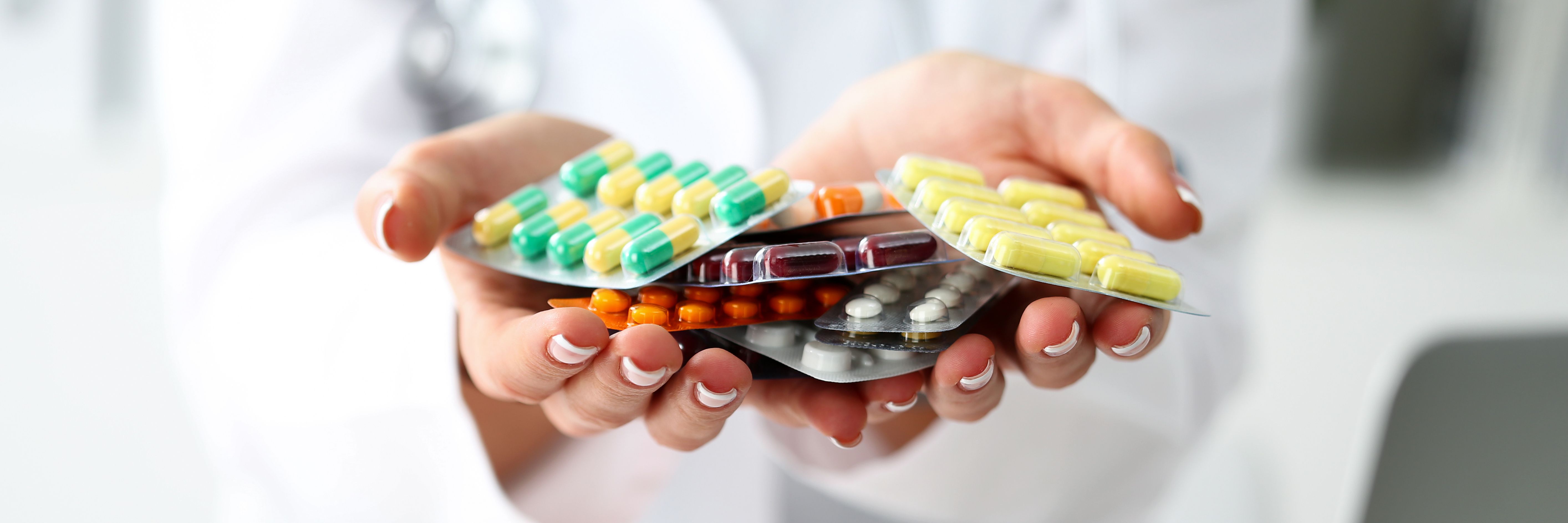Female doctor hand holding pack of different tablet blisters - Image credit: Megaflopp | stock.adobe.com