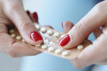 Woman with hormonal birth control pills -- Image credit: megaflopp | stock.adobe.com