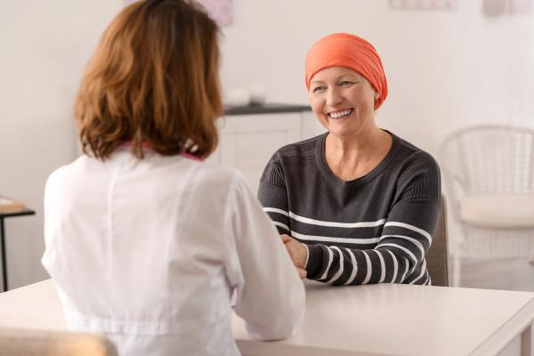 Patient with cancer talking with a pharmacist -- Image credit: Africa Studio | stock.adobe.com