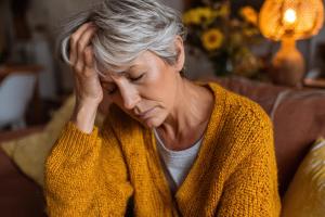 AI-generated image of woman with fatigue -- Image credit: Serhii | stock.adobe.com