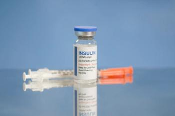 Insulin And Syringes On Metal Tray