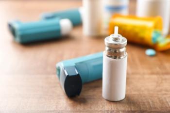 Asthma inhaler with cartridge on wooden table | Image Credit: Africa Studio - stock.adobe.com