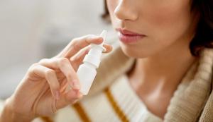 rhinitis, medicine and healthcare concept - close up of sick woman using nasal spray | Image Credit: Syda Productions | stock.adobe.com 