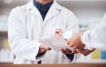 Pharmacist giving patient their prescription -- Image credit: Talia Mdlungu/peopleimages.com | stock.adobe.com