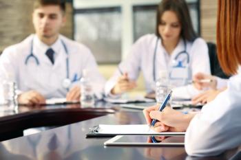 Medical discussion -- Image credit: Africa Studio | stock.adobe.com