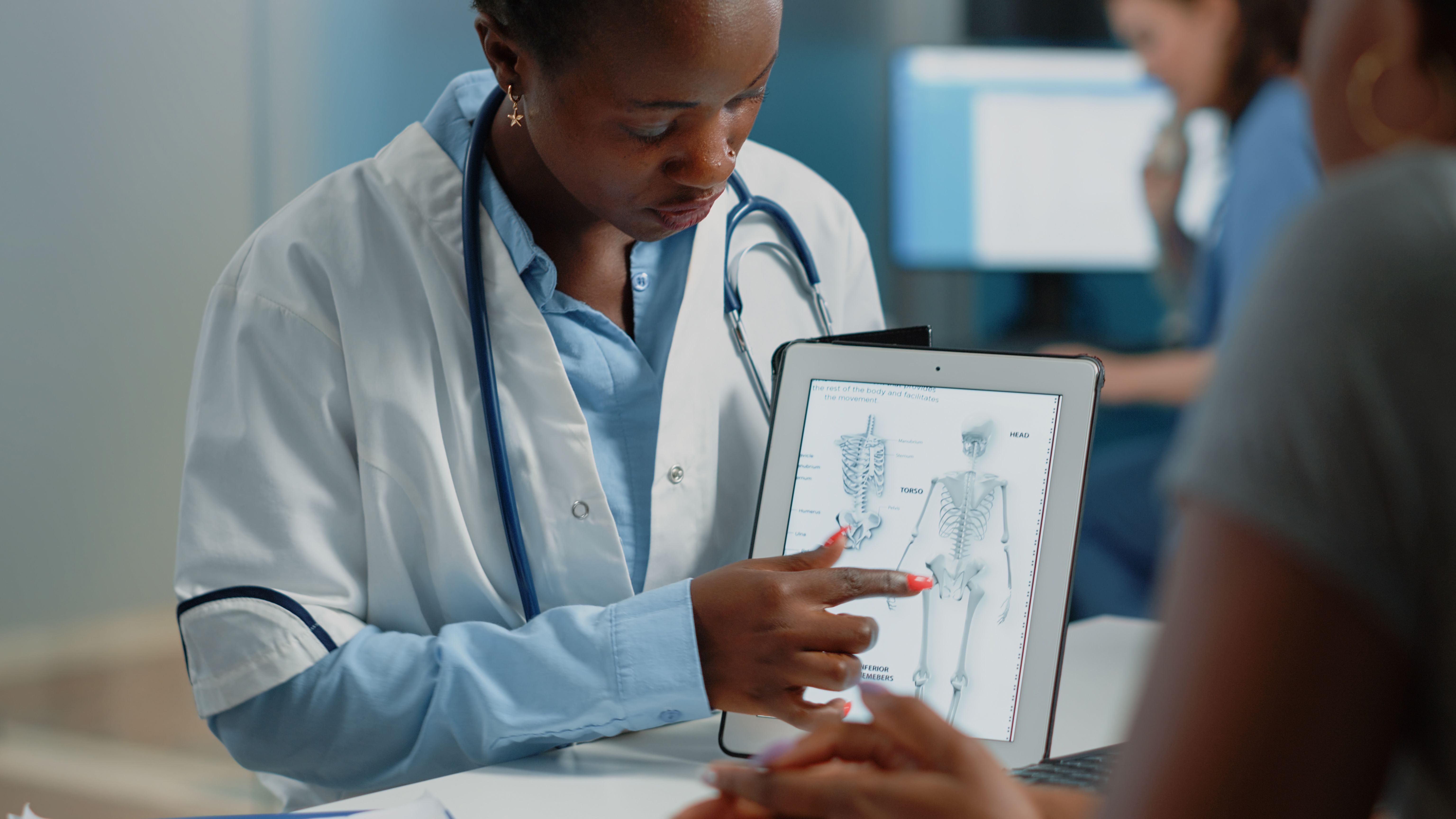 Physician discussing bone health with a patient
