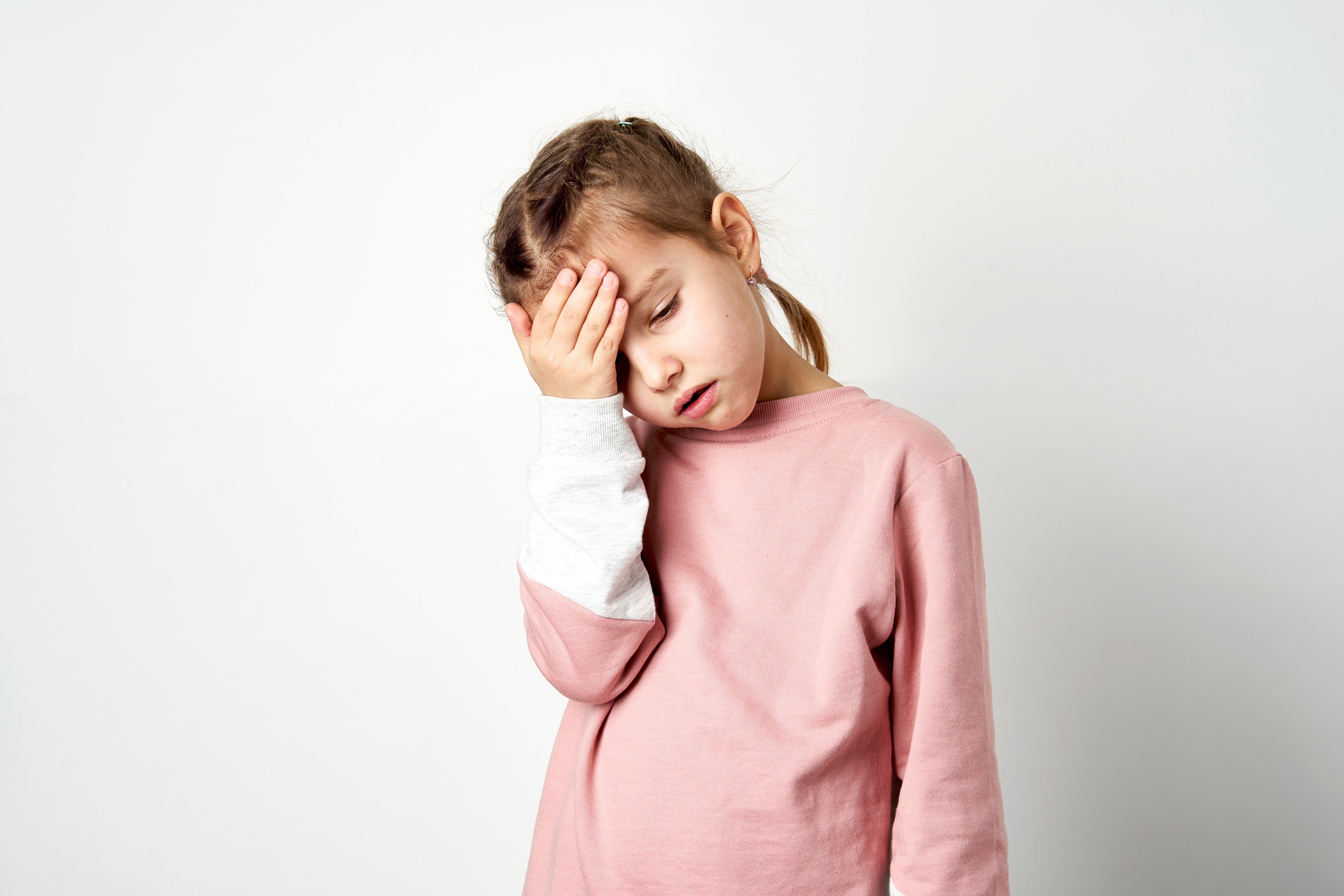 Young girl with migraine -- Image credit: Gecko Studio | stock.adobe.com