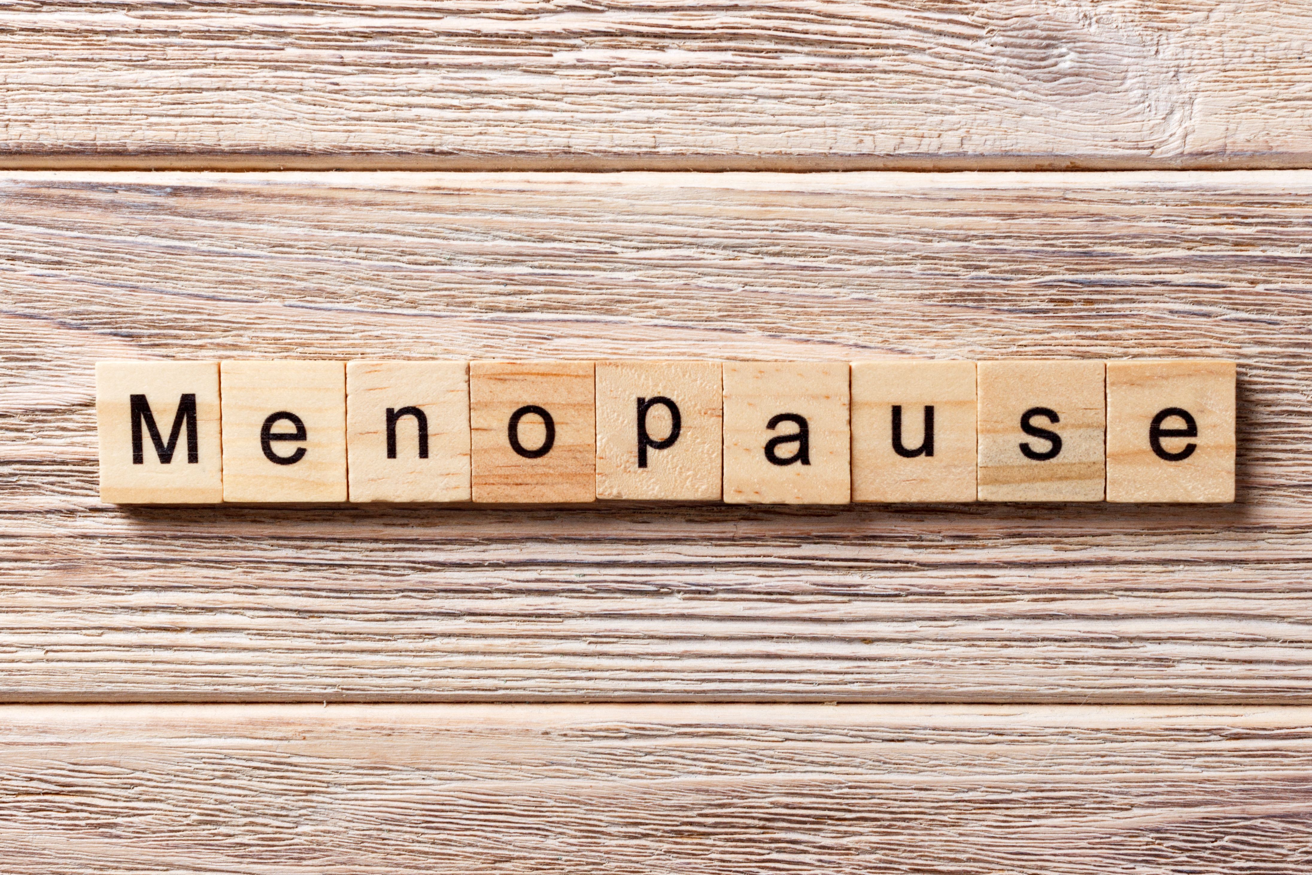 Wooden tiles spelling "menopause" -- Image credit: sosiukin | stock.adobe.com