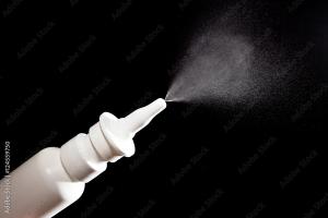 Close-up of nasal drug spraying on black - Image credit: PixieMe | stock.adobe.com